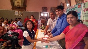 director-shri-kk-yadav-giving-sukanya-samriddhi-passbook-to-girl